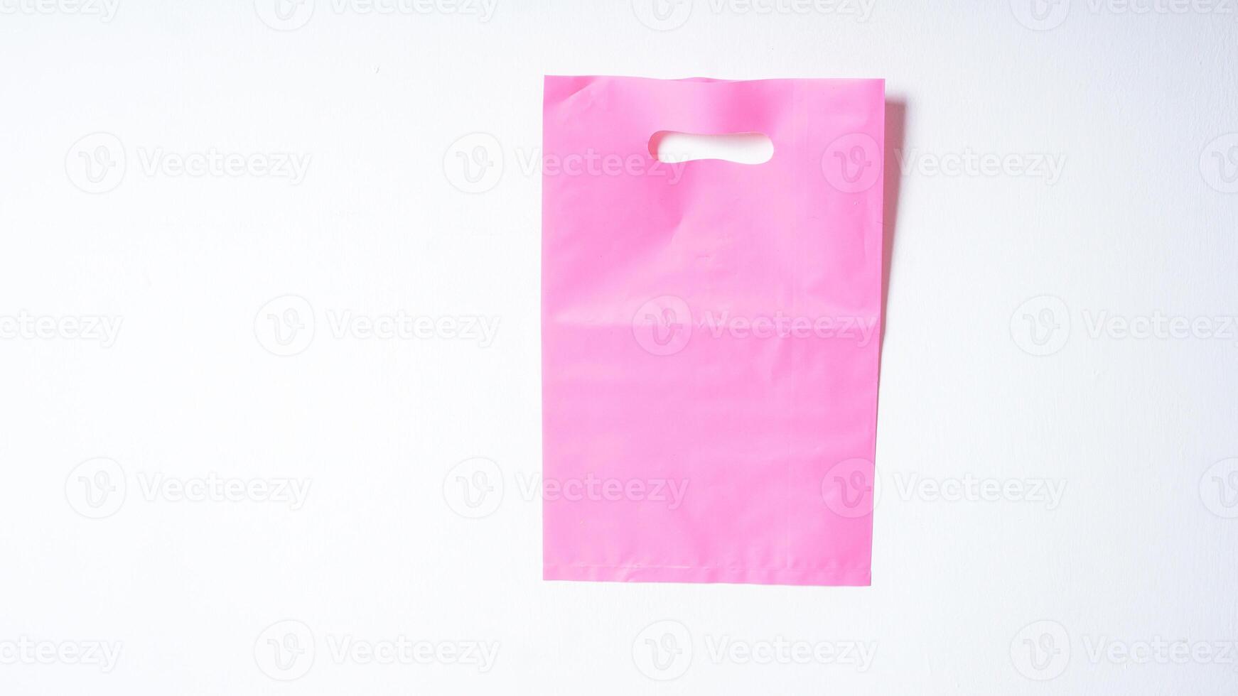 Blank Pink Plastic Bag Mock Up on White Background photo