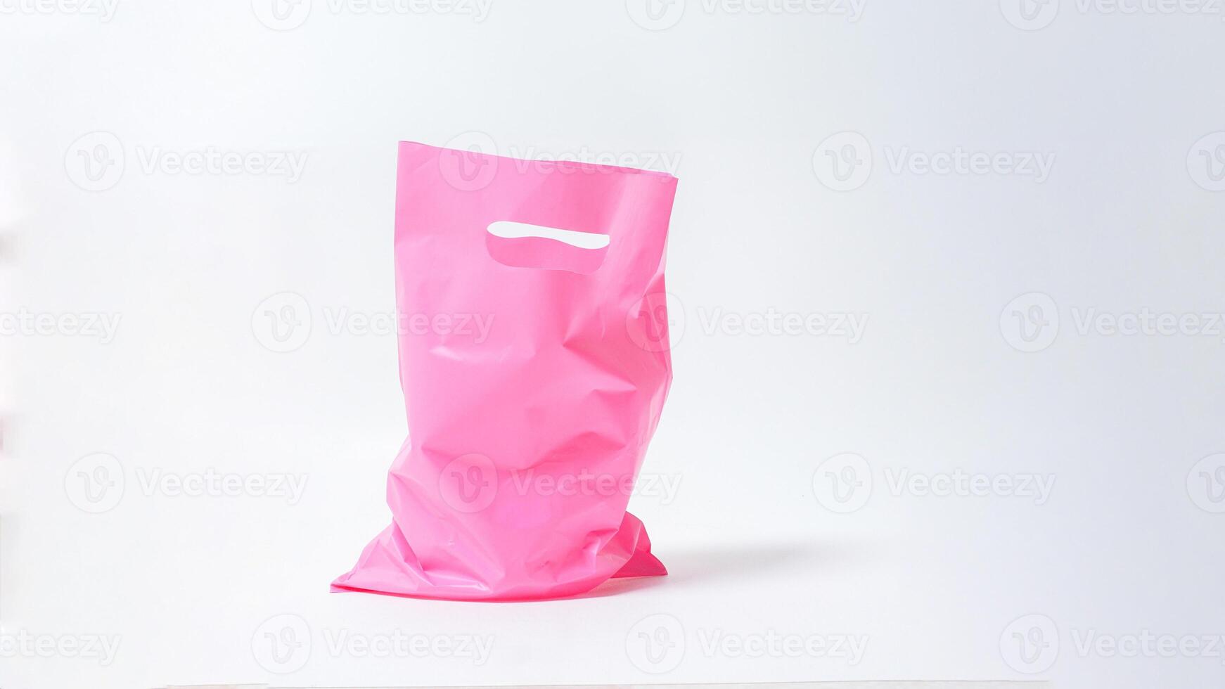 Open Used Pink Plastic Bag Mock Up with Handle on White Background photo