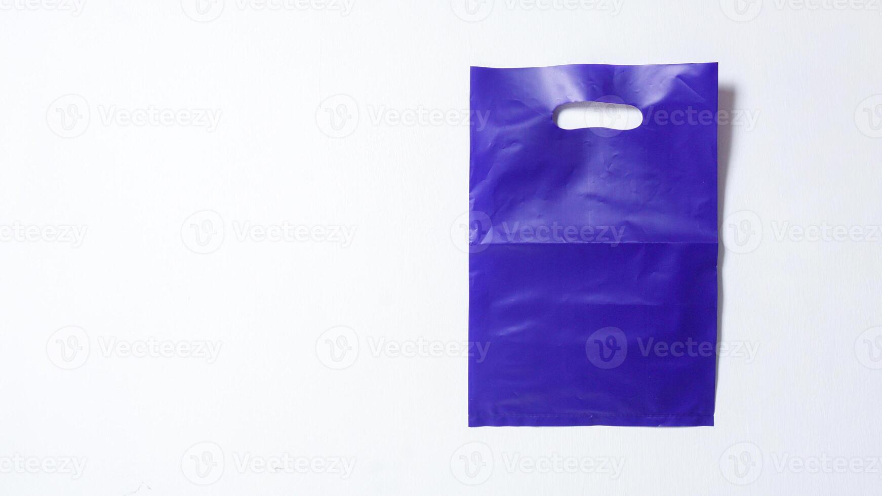 Blank Purple Plastic Bag Mock Up on White Background photo