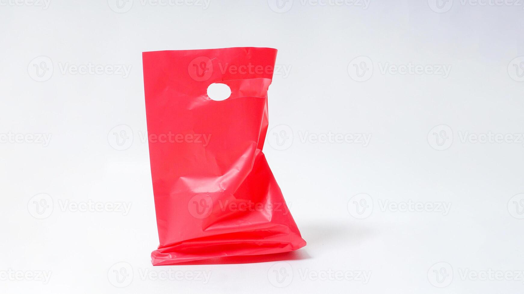 Empty Open Red Pink Plastic Bag Mock Up with Handle on White Background photo
