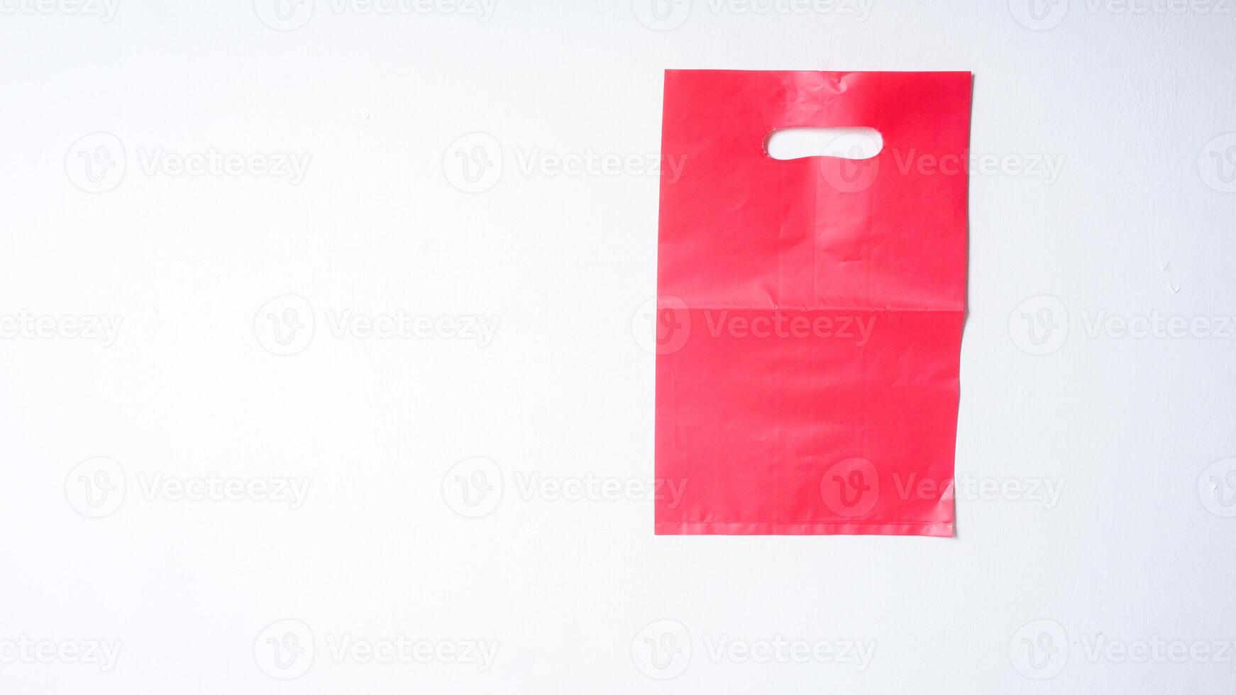 Blank Red Pink Plastic Bag Mock Up on White Background photo