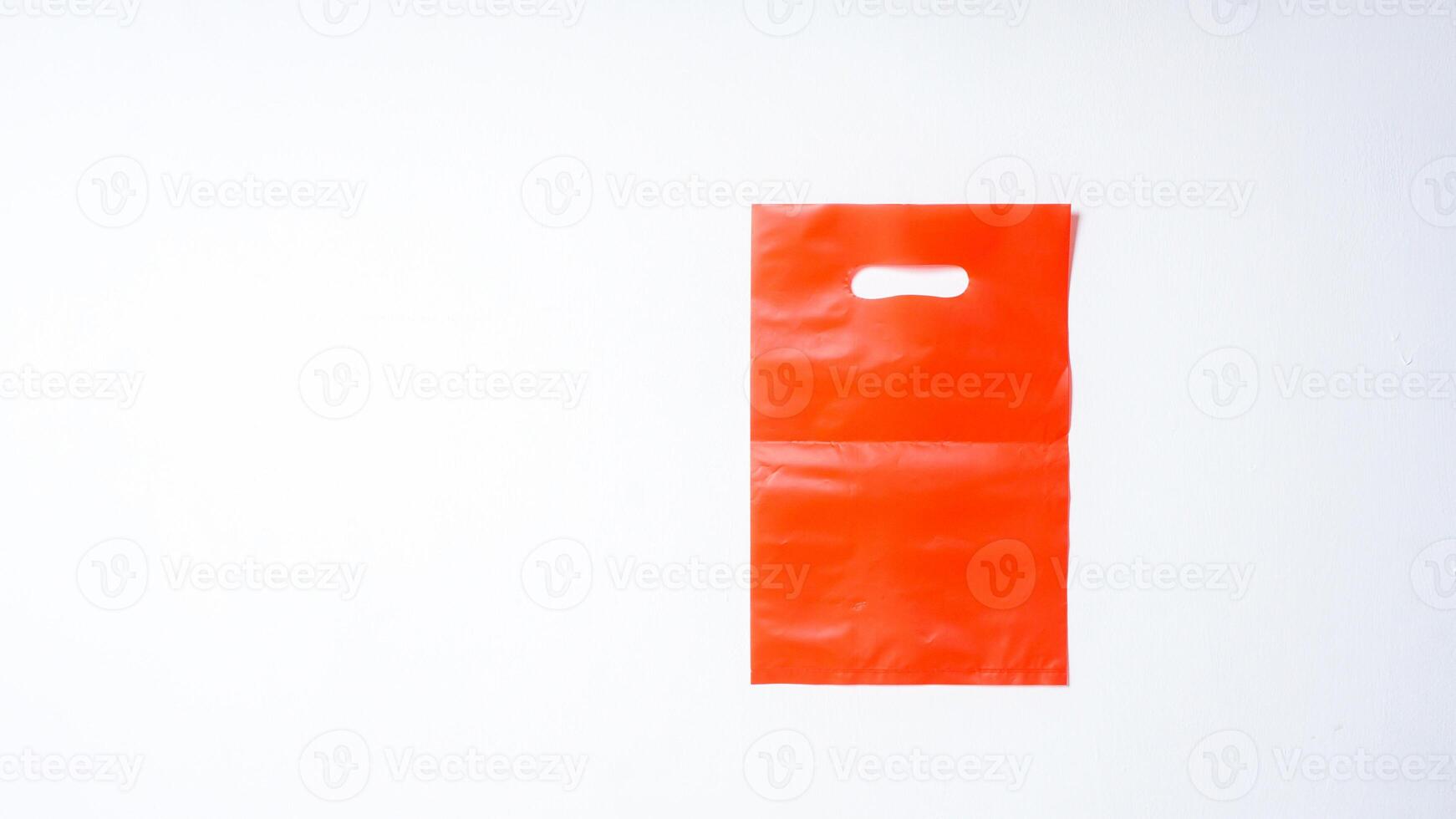 Blank Red Plastic Bag Mock Up on White Background photo