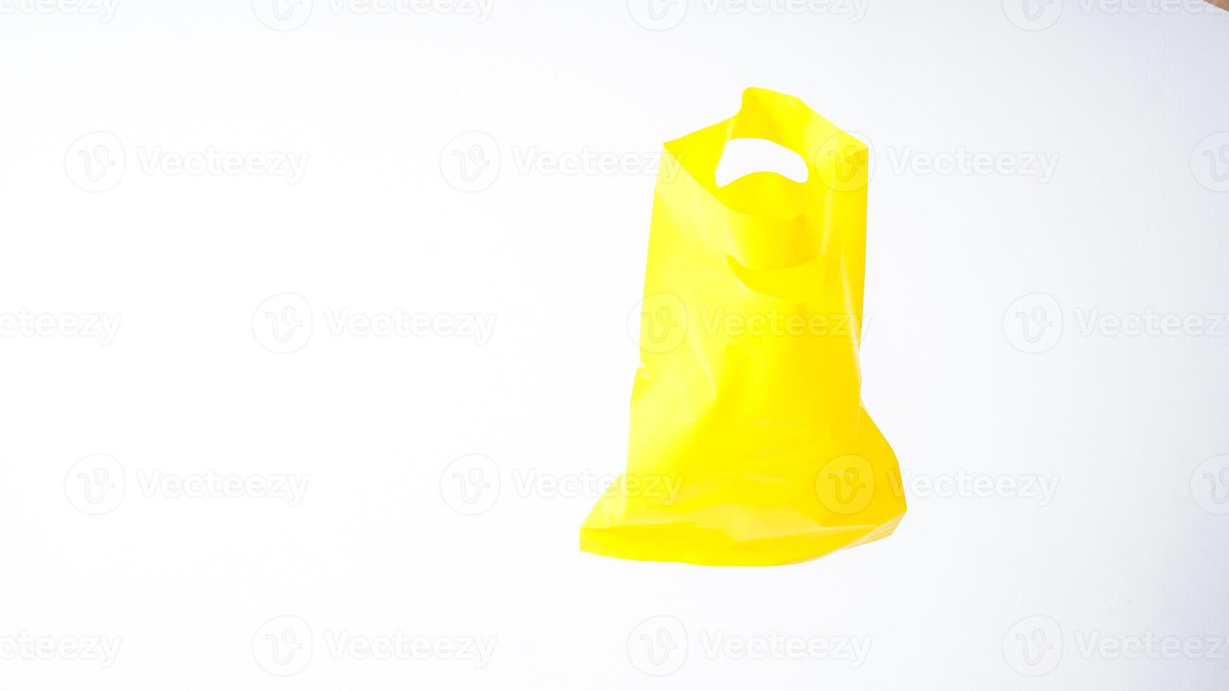 Open Yellow Plastic Bag on White Background photo