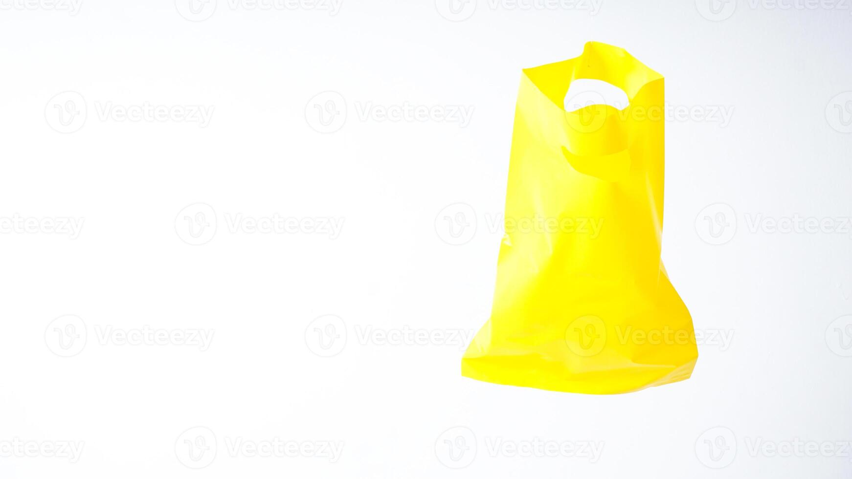 Empty Open Yellow Plastic Bag Mock Up with Copy Space on White Background photo