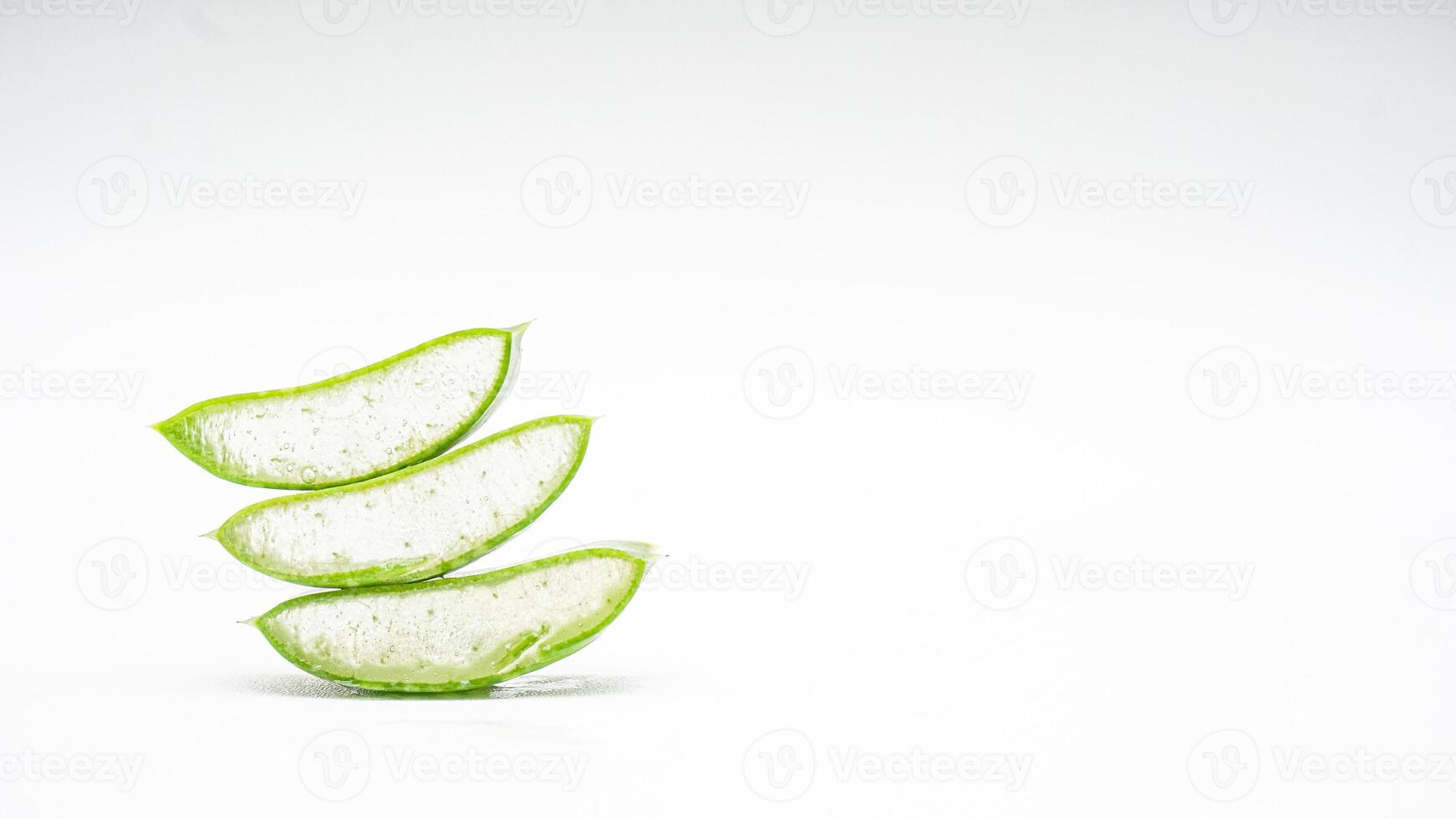 Heap of Aloe Vera Slices on White Background photo