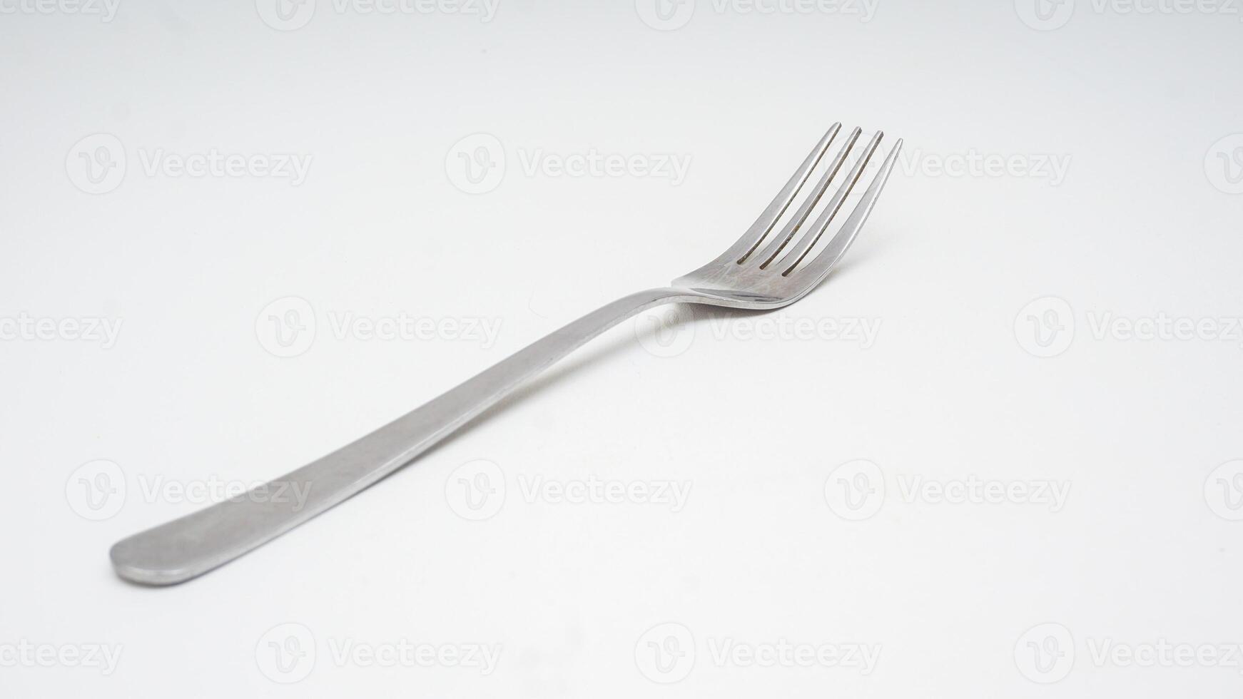Modern stainless steel fork isolated on white background photo