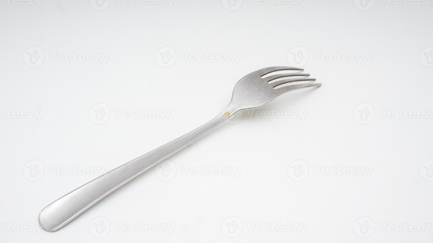 Stainless steel fork cutlery isolated on white background photo