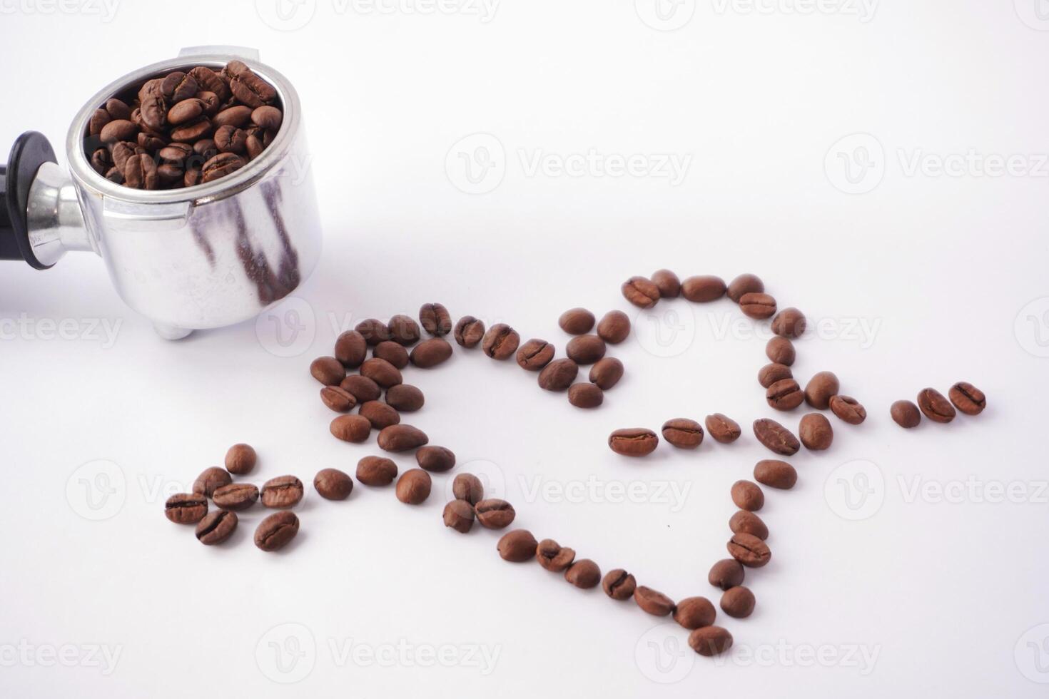 Coffee beans forming a heart shape with a portafilter photo
