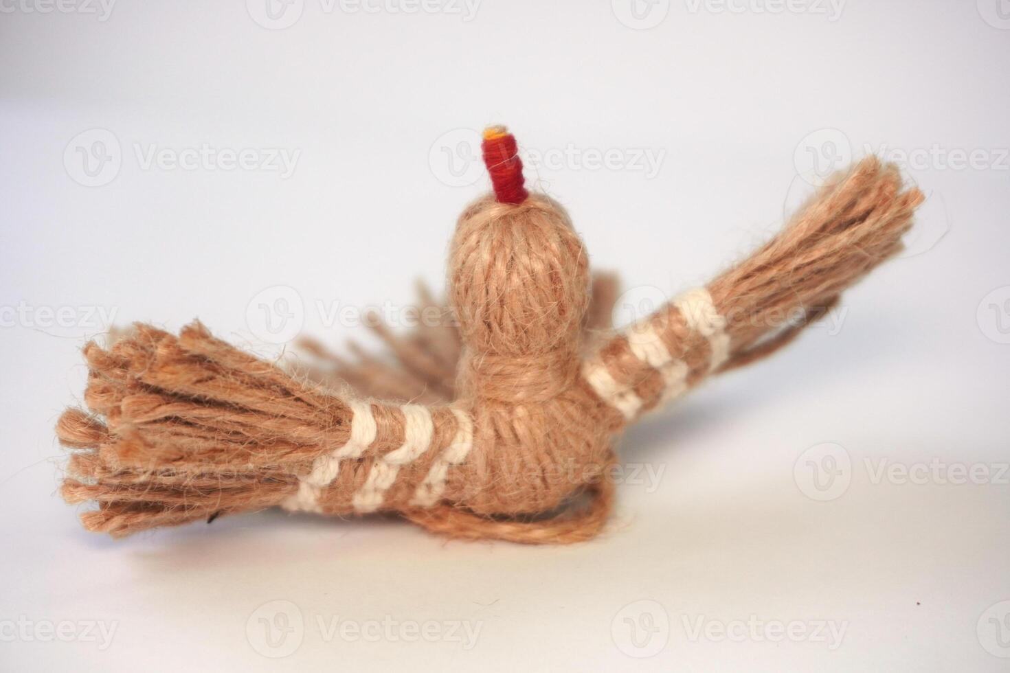 Close-up of a handmade yarn bird with detailed texture photo