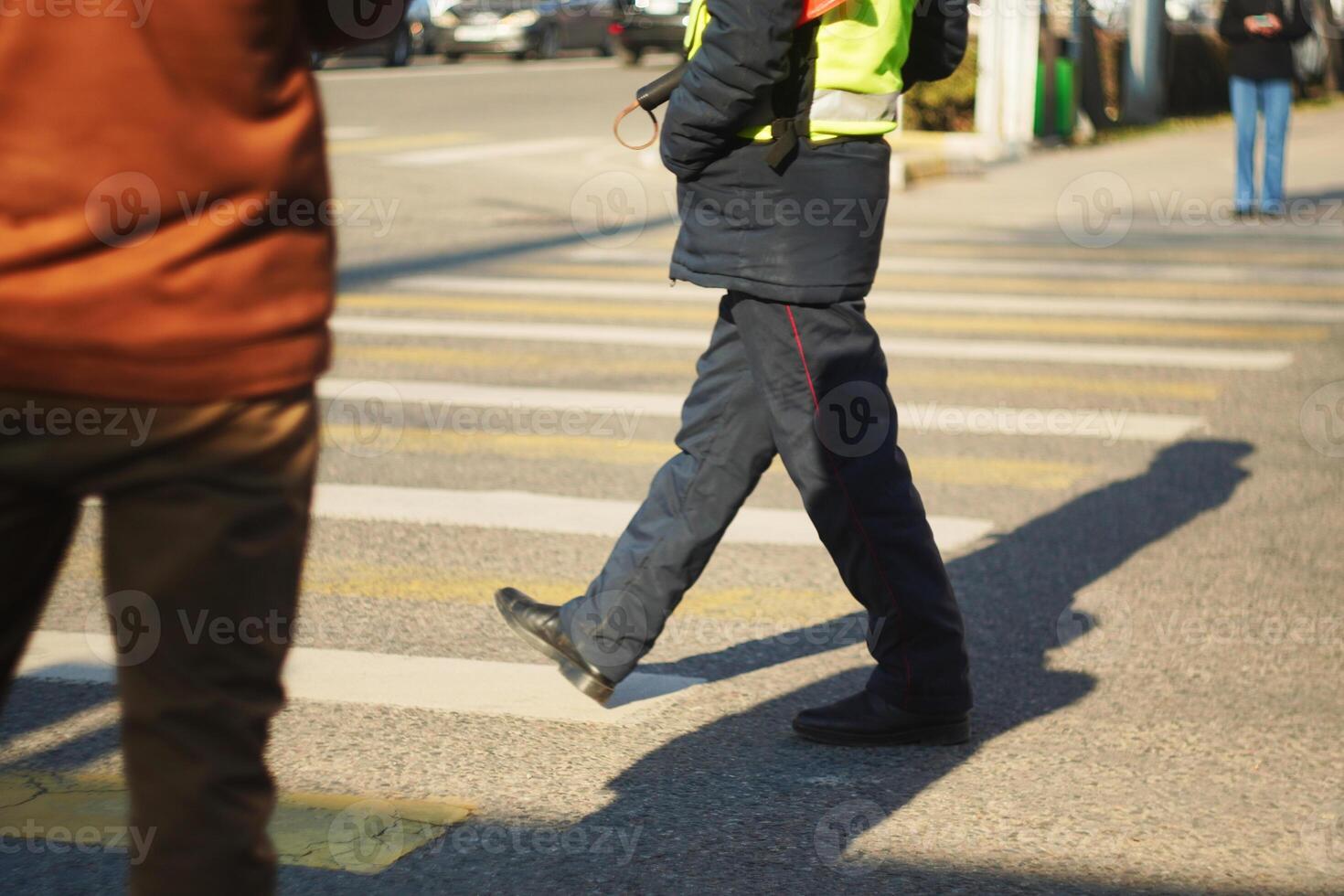 Traffic Controller Police Walking on Crosswalk photo