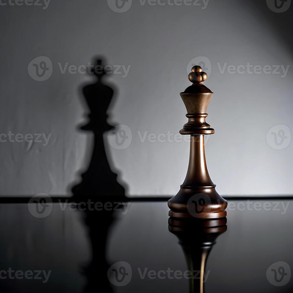 A Single Chess King Stands in the Spotlight with its Shadow Cast on the Wall Behind it, Representing Leadership, Strategy, and the Weight of Responsibility photo