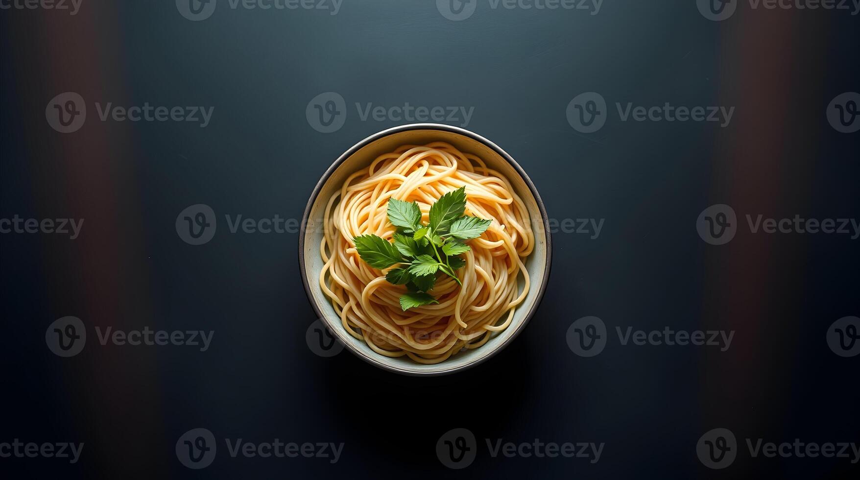 Spaghetti in a bowl on a dark background photo