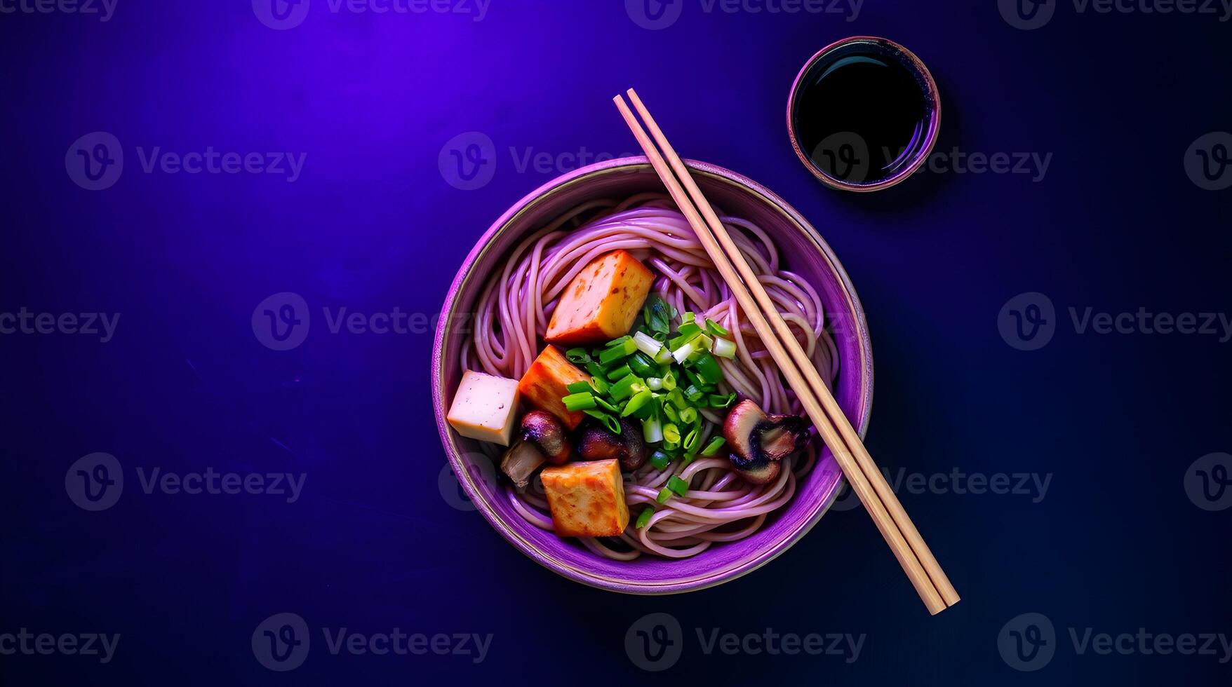 A bowl of noodles with chopsticks on a purple background photo