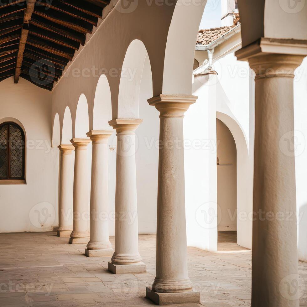 A row of white pillars in a courtyard photo