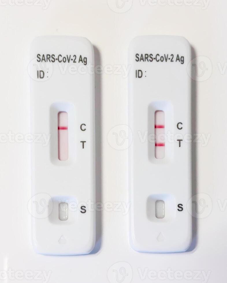 Two sars cov 2 antigen rapid diagnostic test showing positive result photo
