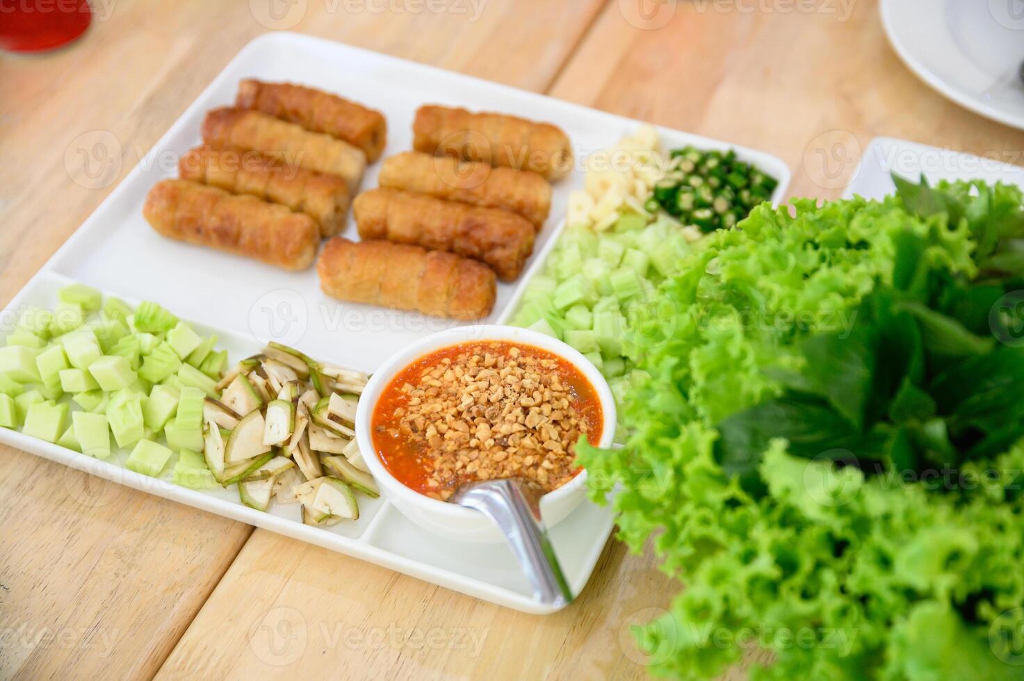 Nam Neaung of vietnam food with roll pork, vegetable and sauce photo