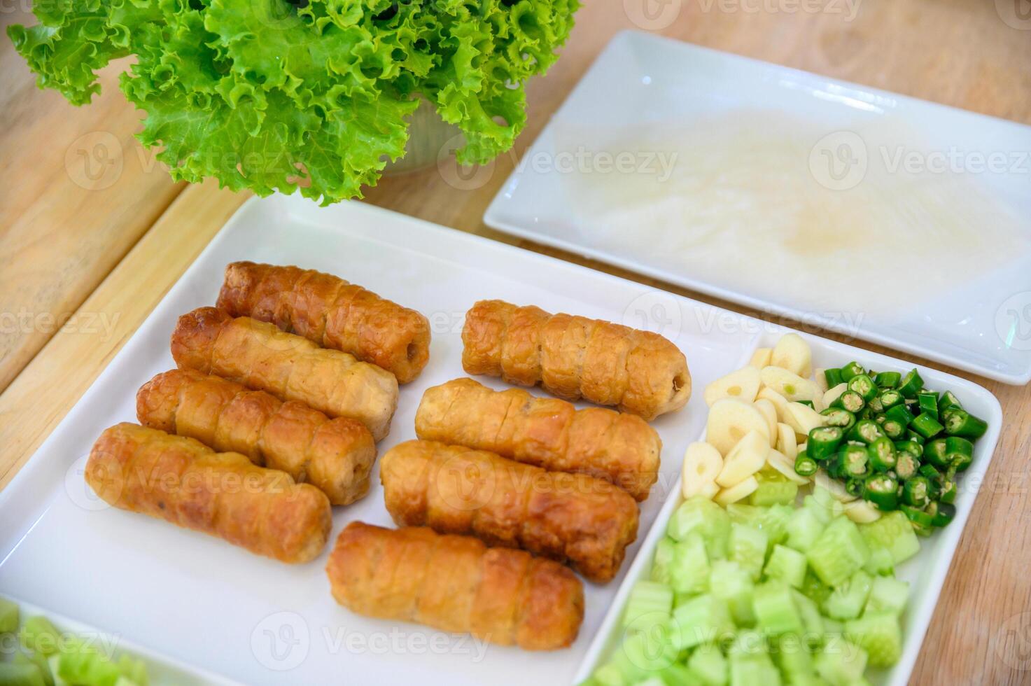 Nam Neaung of Vietnamese food with roll pork, vegetable and sauce photo