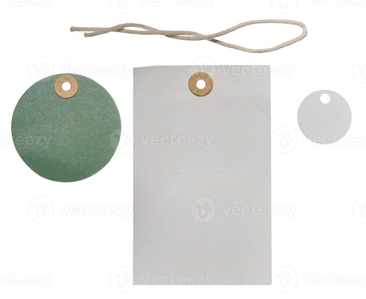 Cardboard round and rectangular clothing tags and rope, isolated background photo