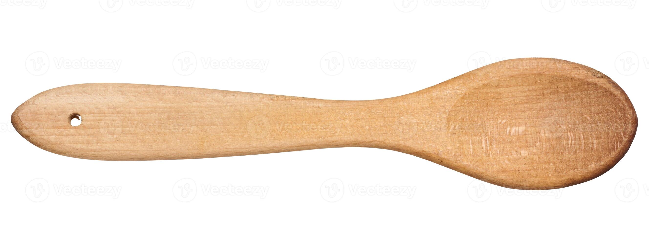 Wooden empty spoon with long handle on isolated background, top view photo