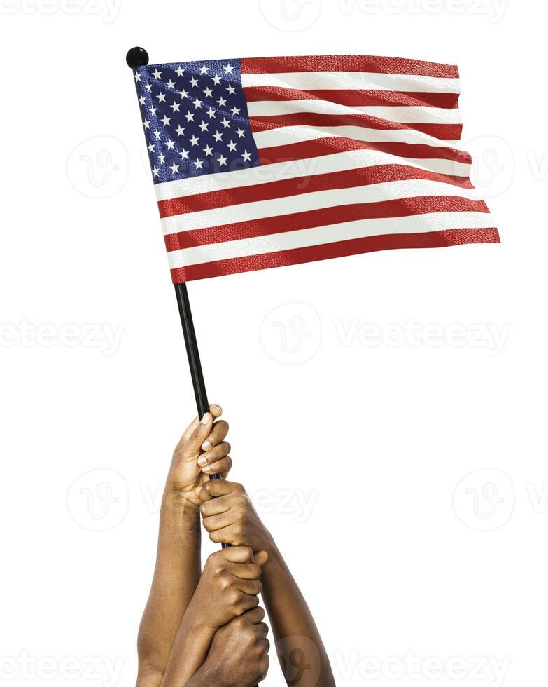 Many different group black African hands holding lifting raising USA national flag isolated over white background. Stretching arms for flag. Togetherness, unity independence day celebration photo
