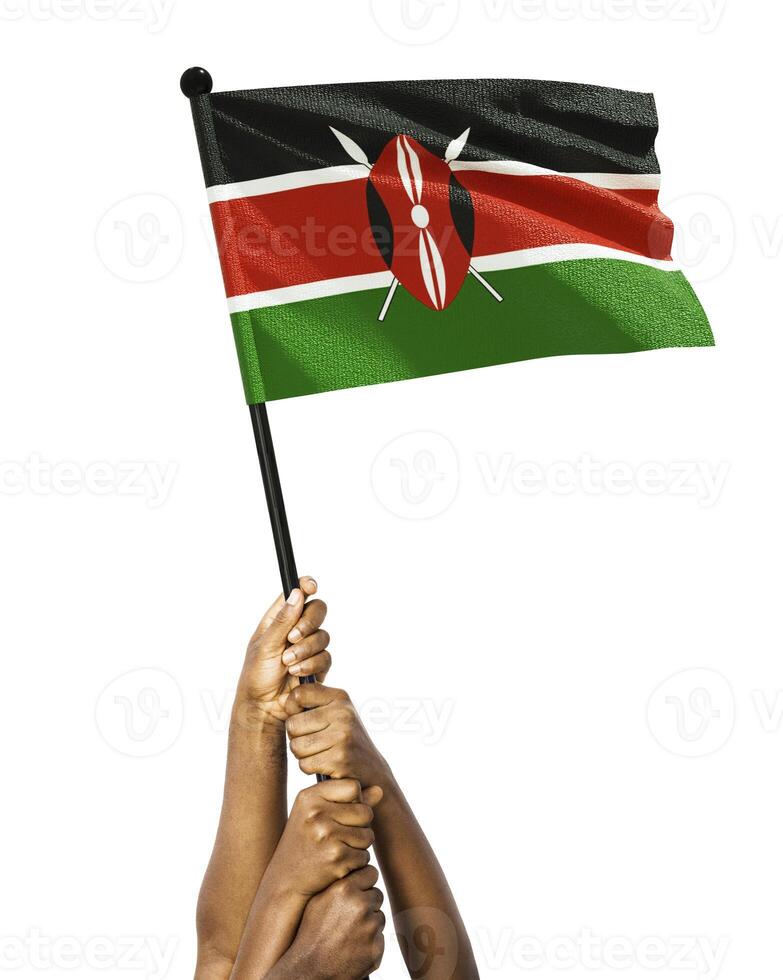Many different group black African hands holding lifting raising kenyan national flag isolated over white background. Stretching arms for flag. Togetherness, unity independence day celebration photo