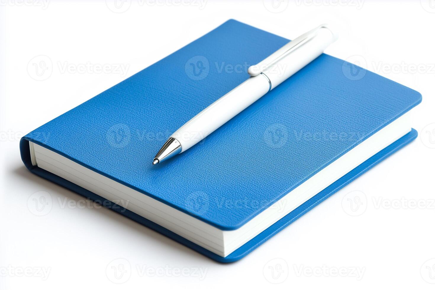Blue notebook with pen on white background photo