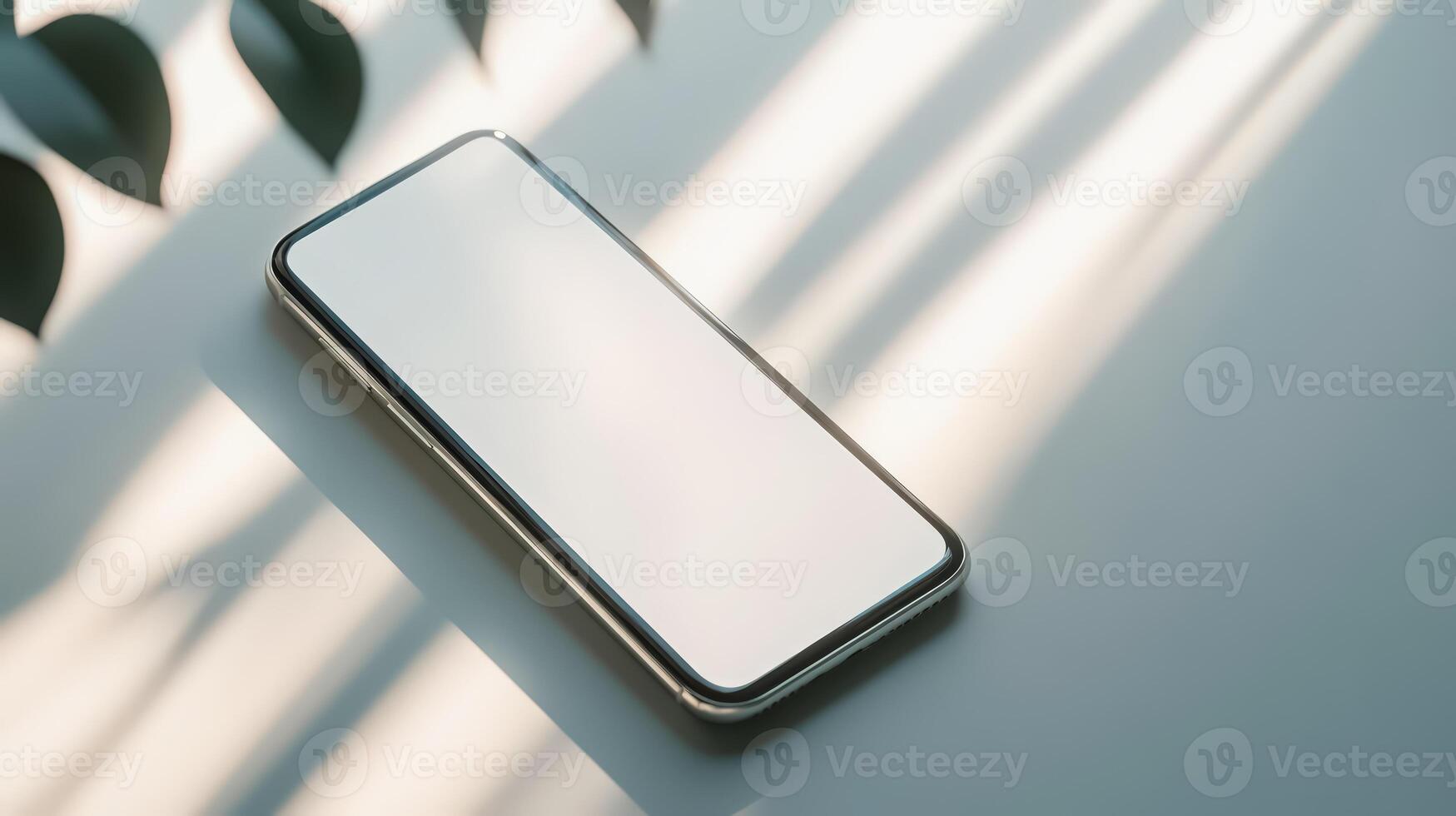 An iphone is shown on a table with a leaf photo