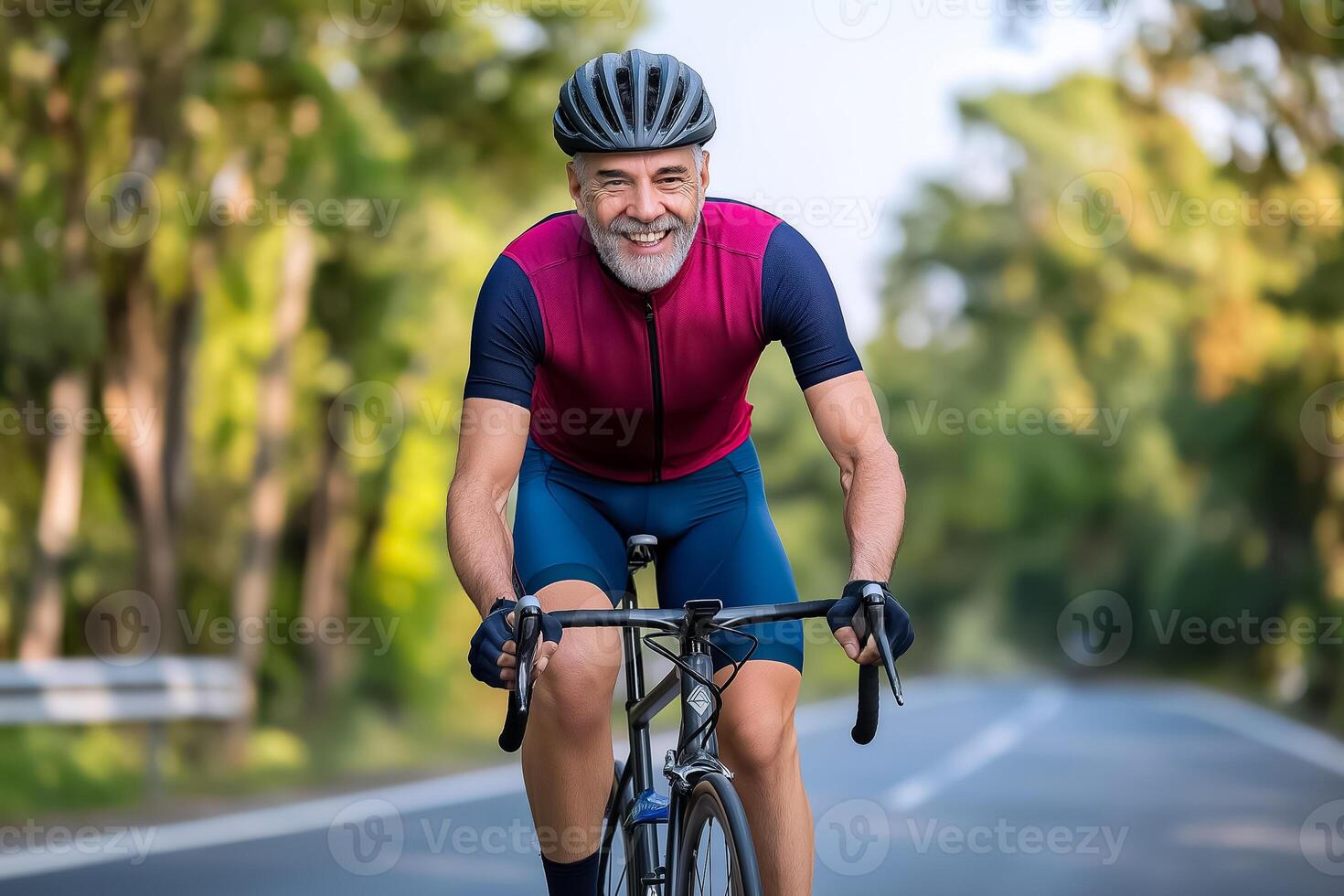 An older man riding a bike on a road photo