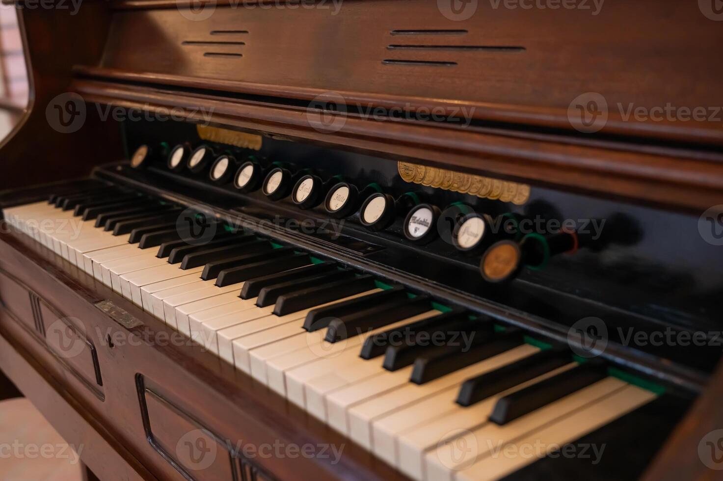 An old organ with keys and buttons photo