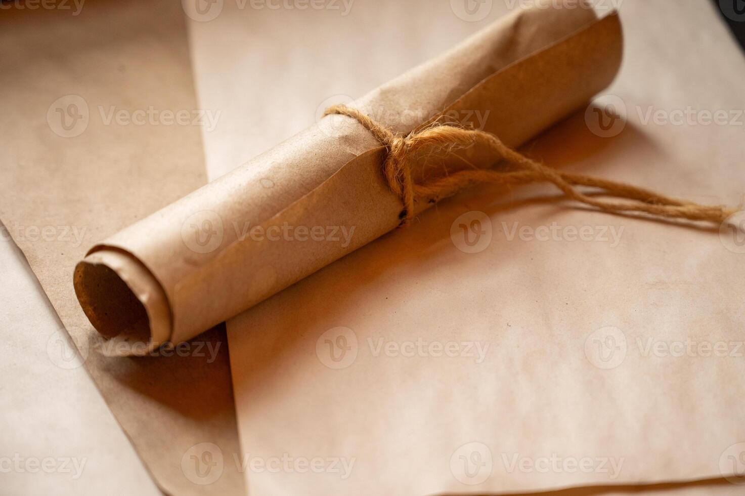 a rolled up piece of paper with a piece of string photo