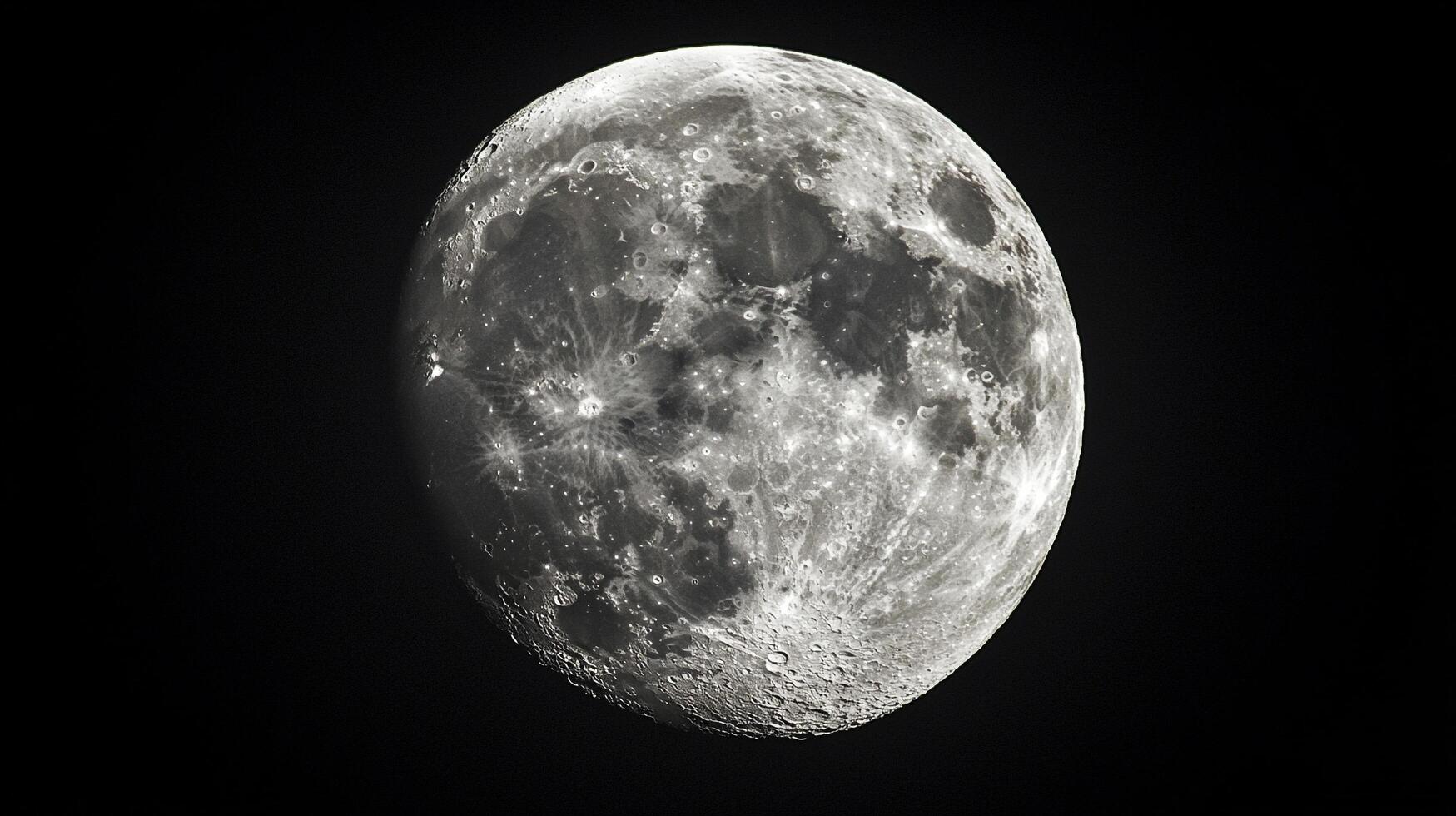 Detailed full moon showcasing its illuminated surface, craters, and lunar landscape against a stark black sky.Celestial body in space. photo