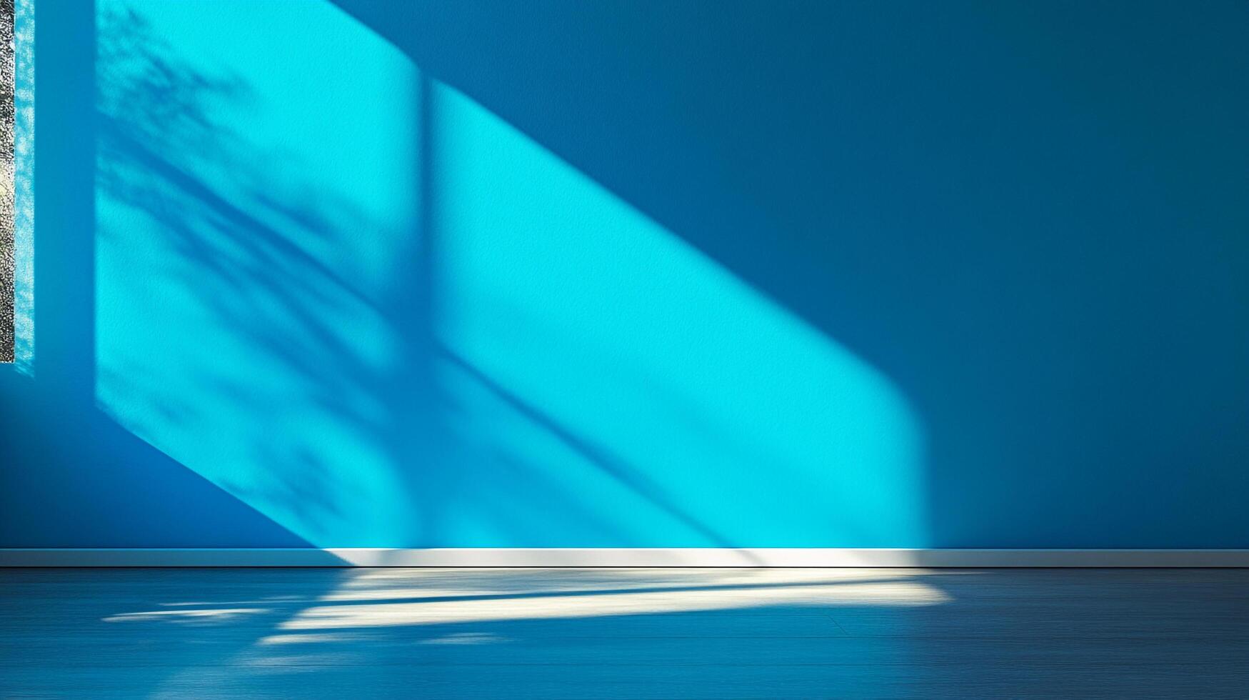 A room with a blank blue wall is brightly illuminated by sunbeams, creating shadows that add depth and dimension to the simple interior. photo
