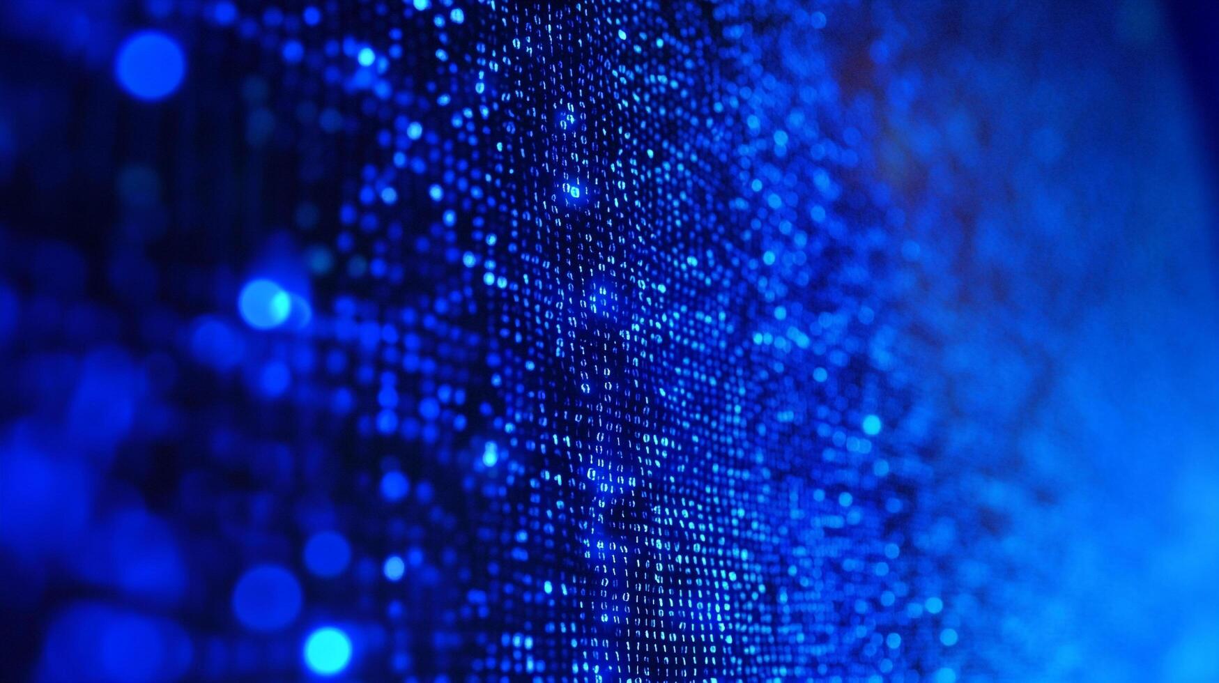 Abstract blue digital background representing computer data and information technology. Shows binary code with bokeh effect in the foreground. photo