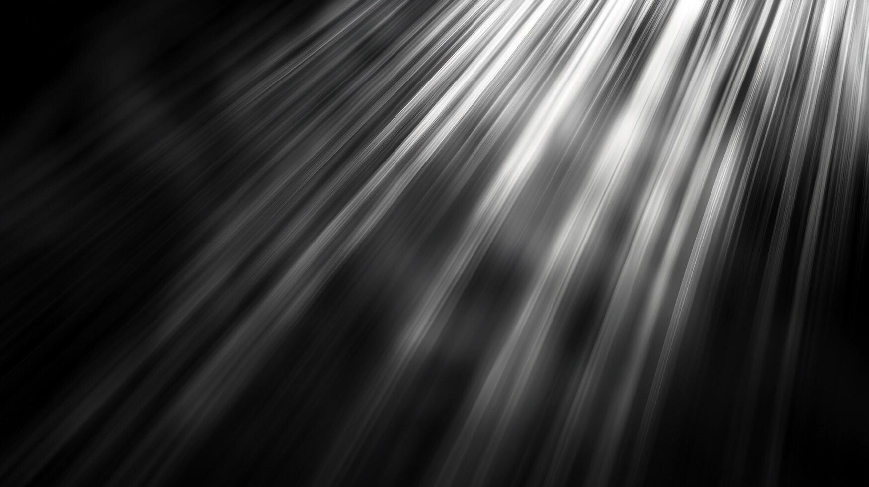 Rays of light stream diagonally across a dark background, illuminating the scene with ethereal beams and shadows. Black and white contrast. photo