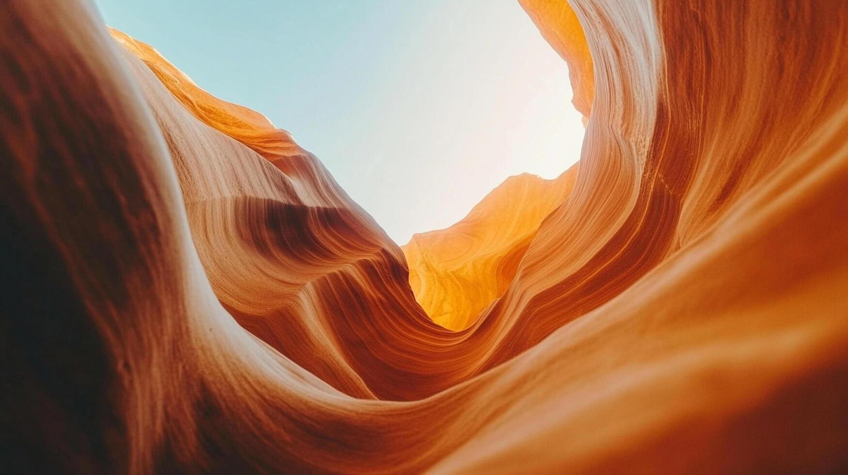 Striated sandstone canyon walls curve dramatically, revealing sky above. Natural rock formations create a mesmerizing landscape. Abstract, earthy. photo