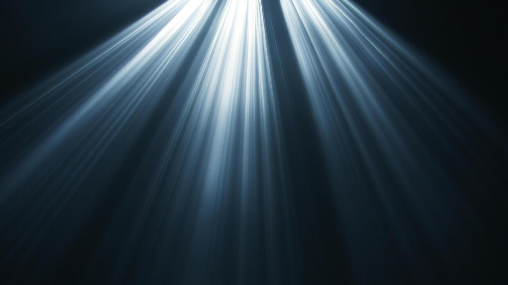 Rays of light cascade from above, piercing the darkness with ethereal illumination, creating a serene and atmospheric ambiance. photo