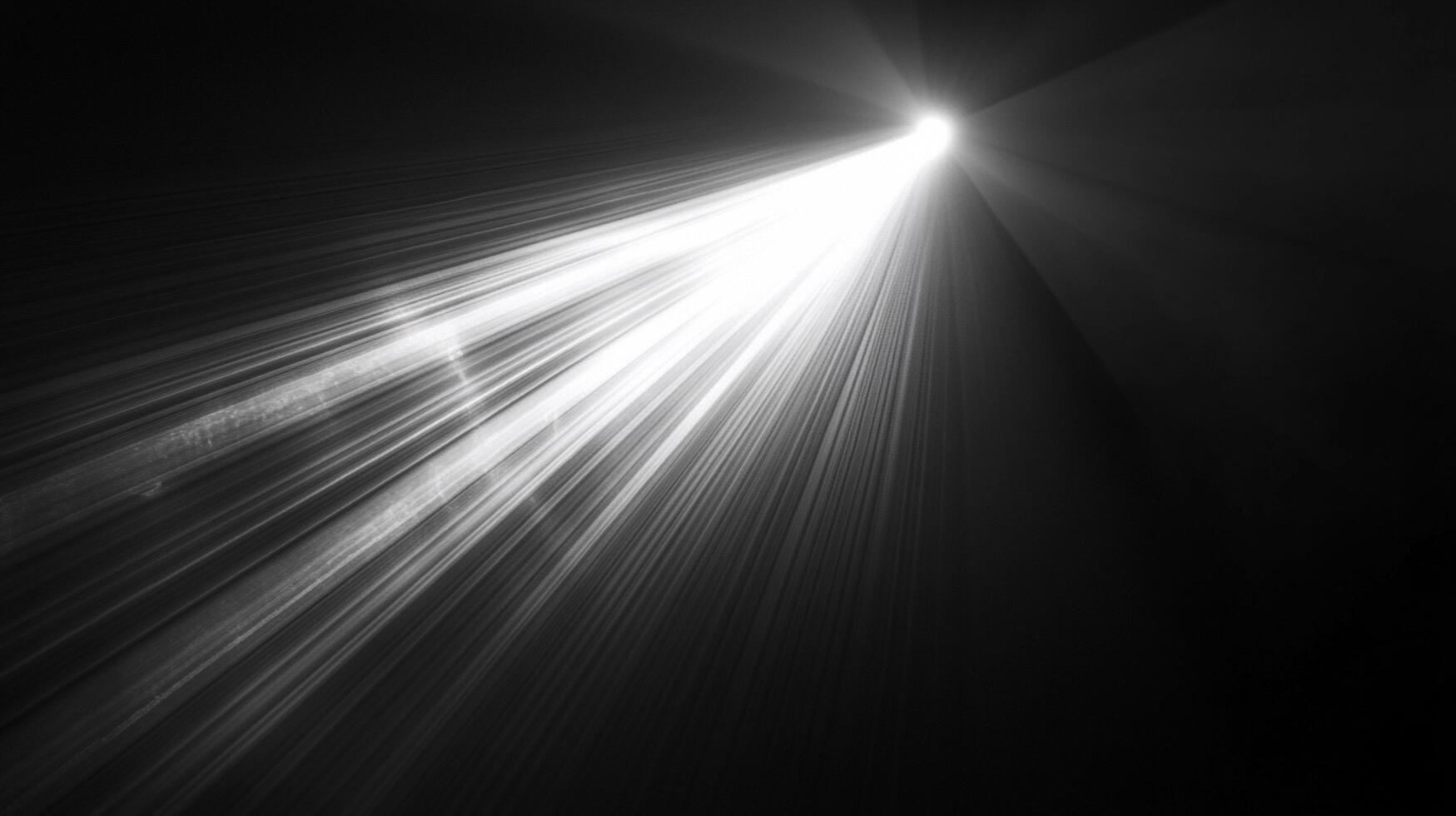A bright, white light beam shines down into a dark background, creating a dramatic contrast between light and shadow, perfect as a background. photo