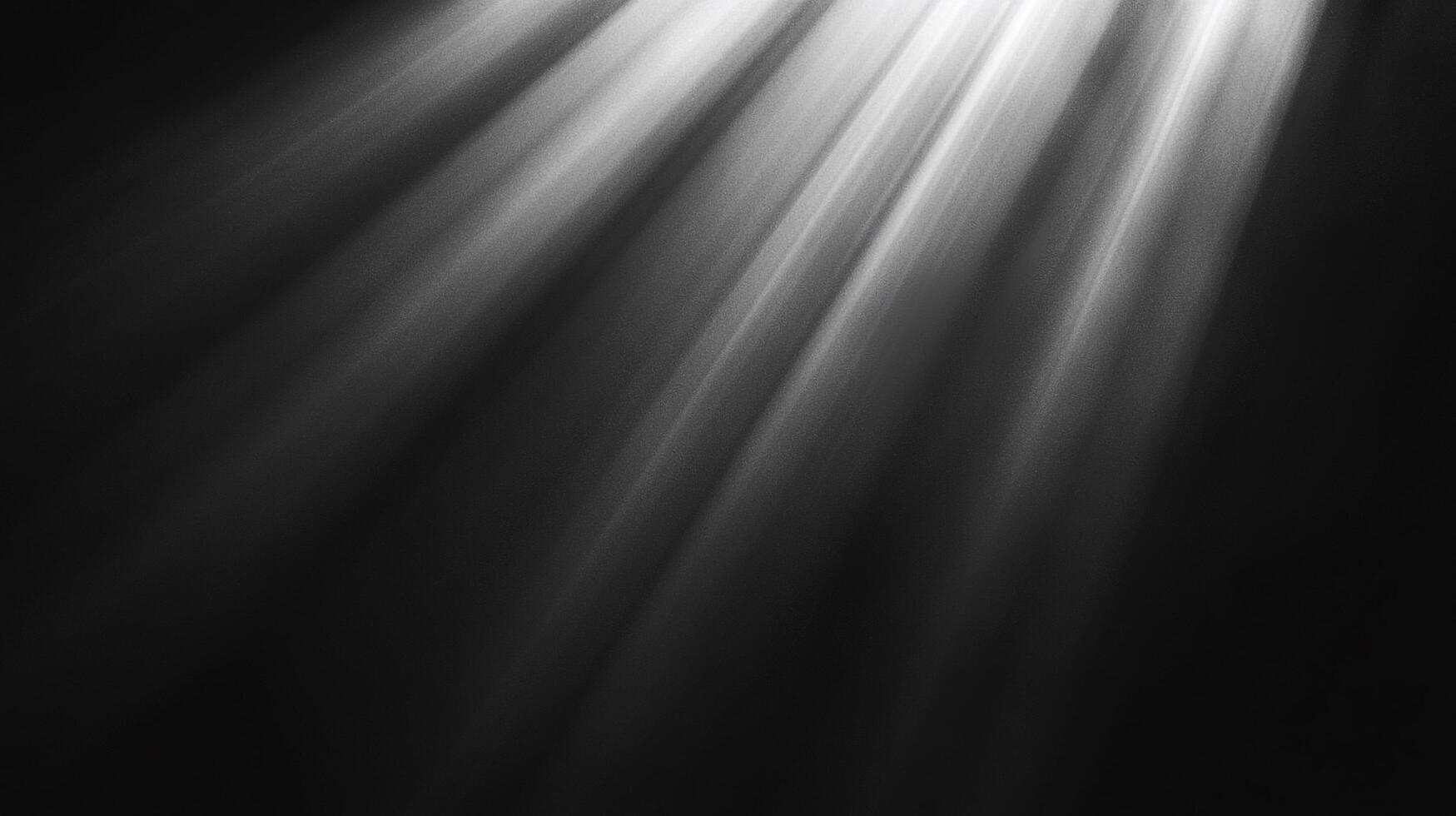Light streams from the top right corner of the frame, creating a captivating contrast against the darkness below, creating a dramatic effect. photo