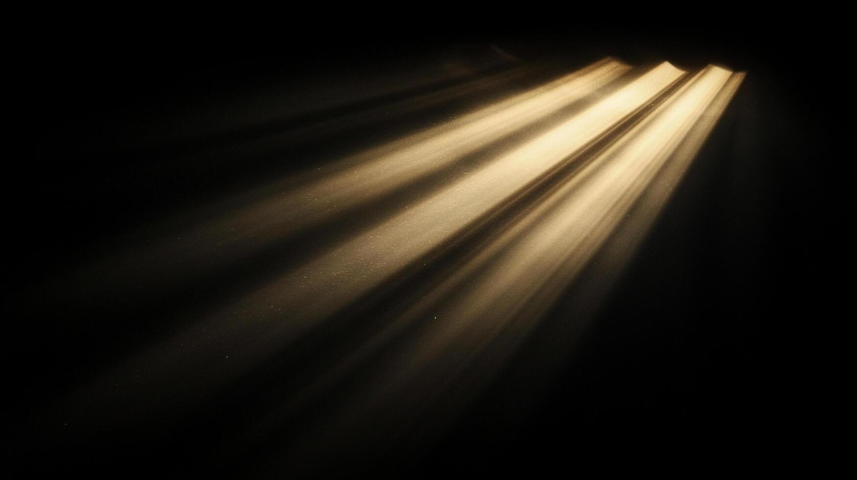 Rays of light streaming downward through dust particles, illuminating a dark space with a dramatic and ethereal glow. photo