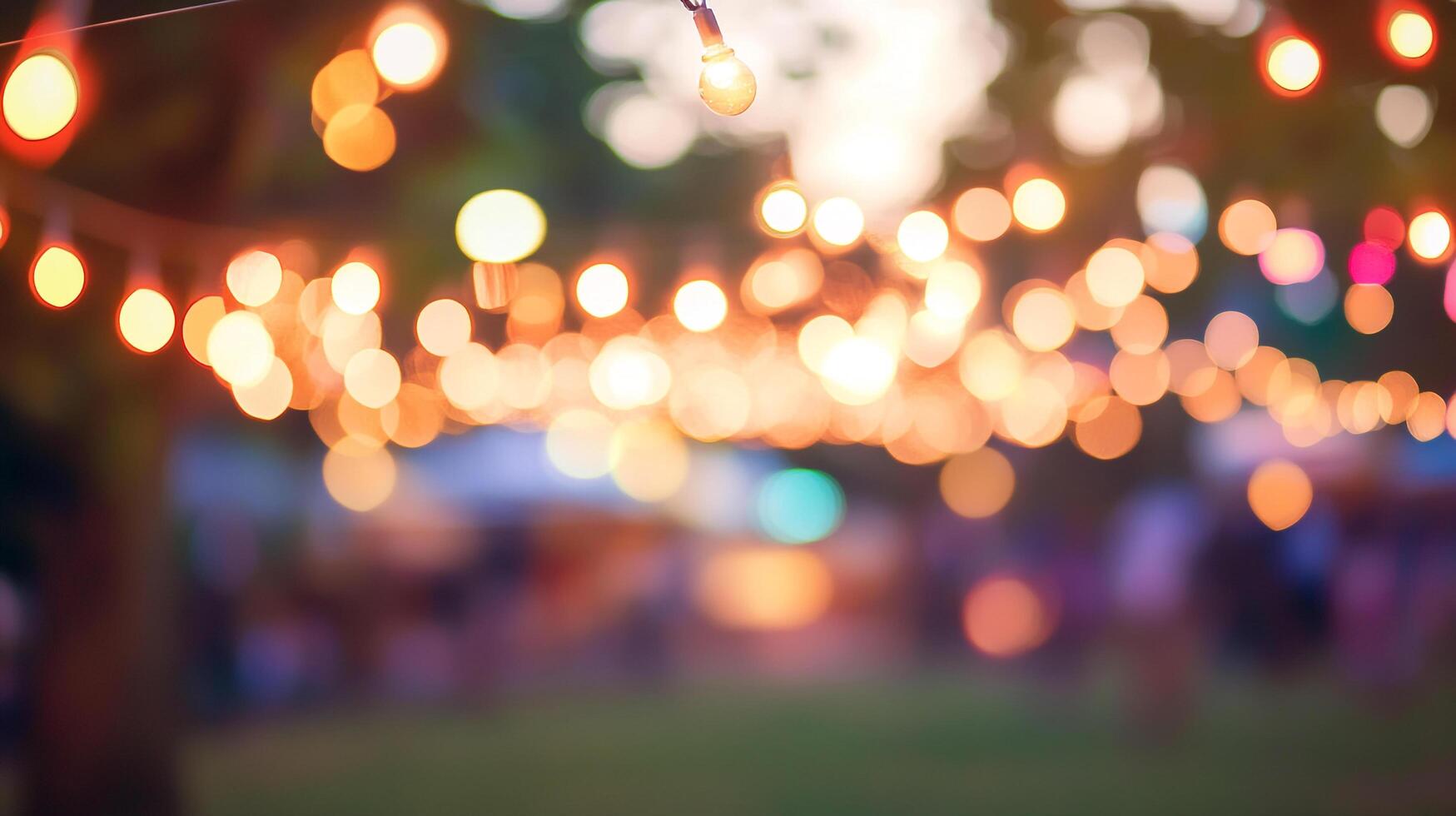Warm, festive atmosphere created by string lights glowing in soft focus, perfect for celebrations or cozy gatherings in an outdoor setting. photo