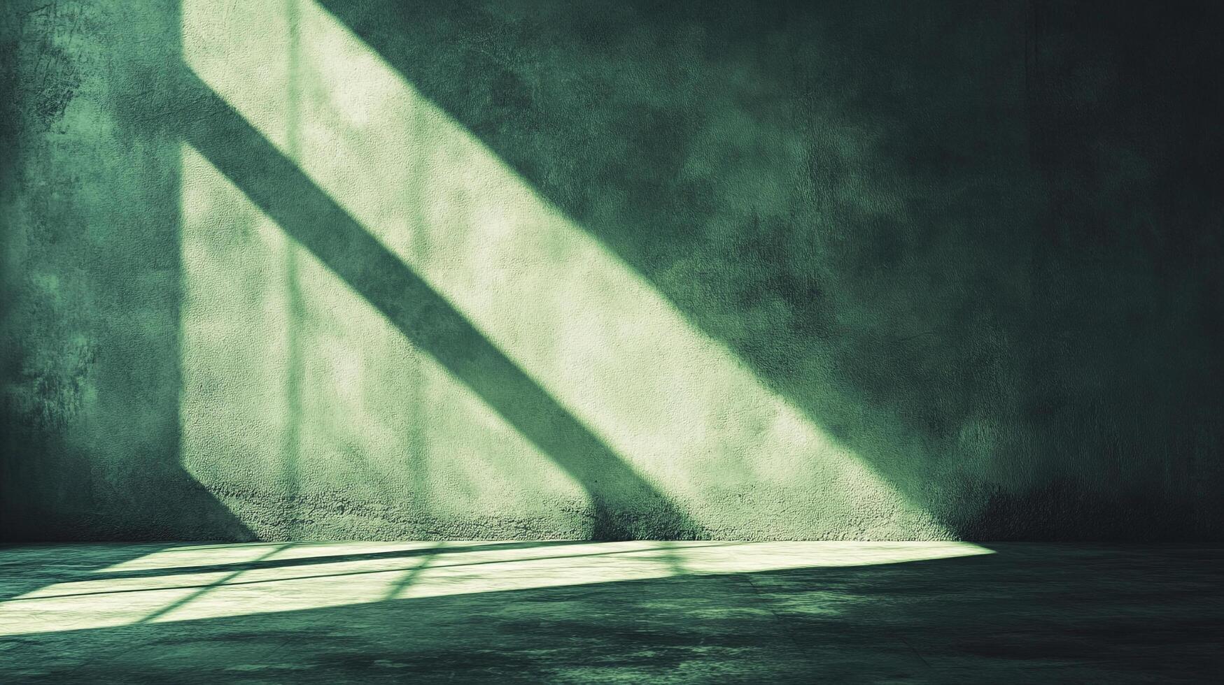 Light streams across a darkened room, highlighting the textured wall and casting stark shadows on the concrete floor below. The light is surreal. photo