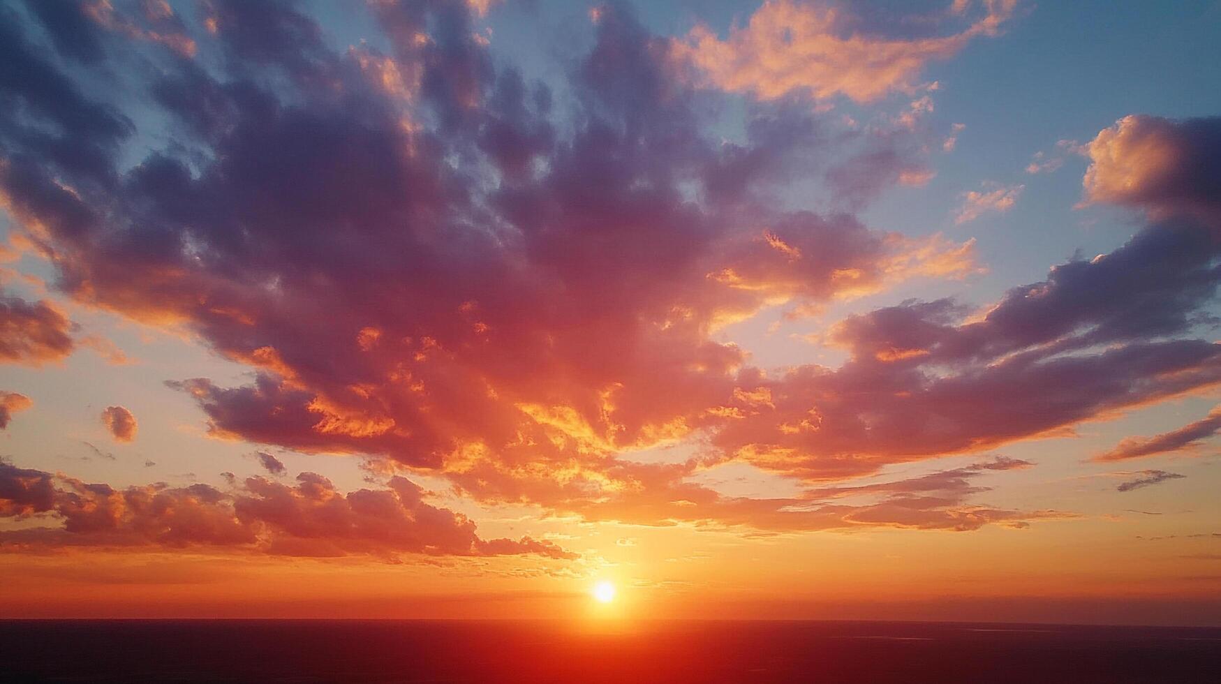 Colorful sunset over the horizon. Beautiful bright light from the sun peeks through the clouds on the horizon. A scenic view of dusk. photo
