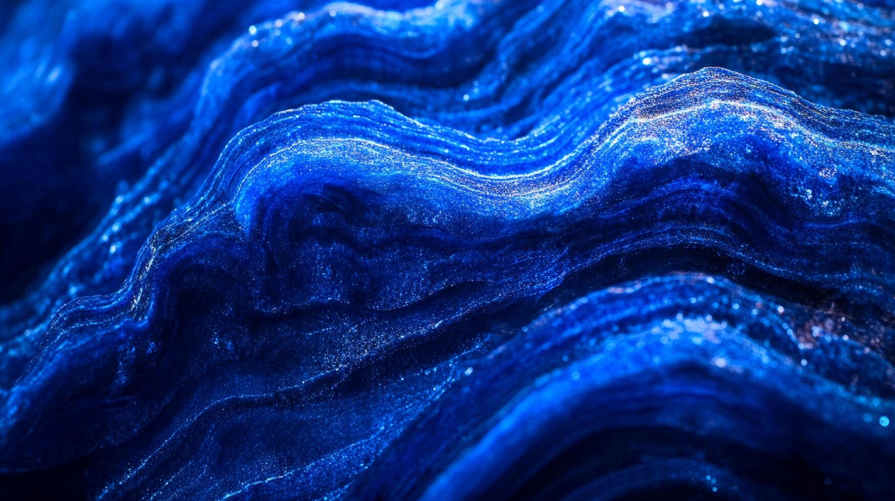 Intricate blue waves, shimmering with light, evoke a sense of depth and fluidity, capturing nature's artistry in an abstract form. photo