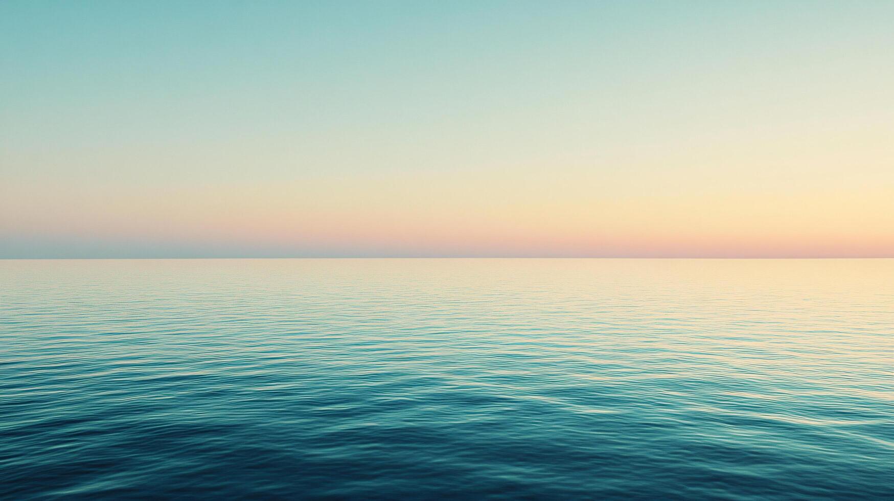 Tranquil ocean surface reflecting the soft pastel hues of the sunset sky, creating a serene and minimalist seascape photo