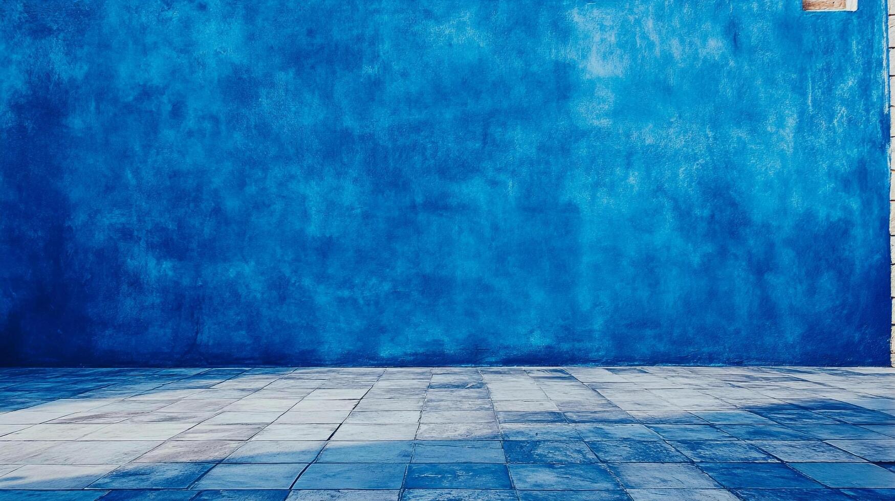 A striking cobalt painted wall meets a tiled floor in a compelling visual interplay, embodying simplicity with a hint of aged texture. photo
