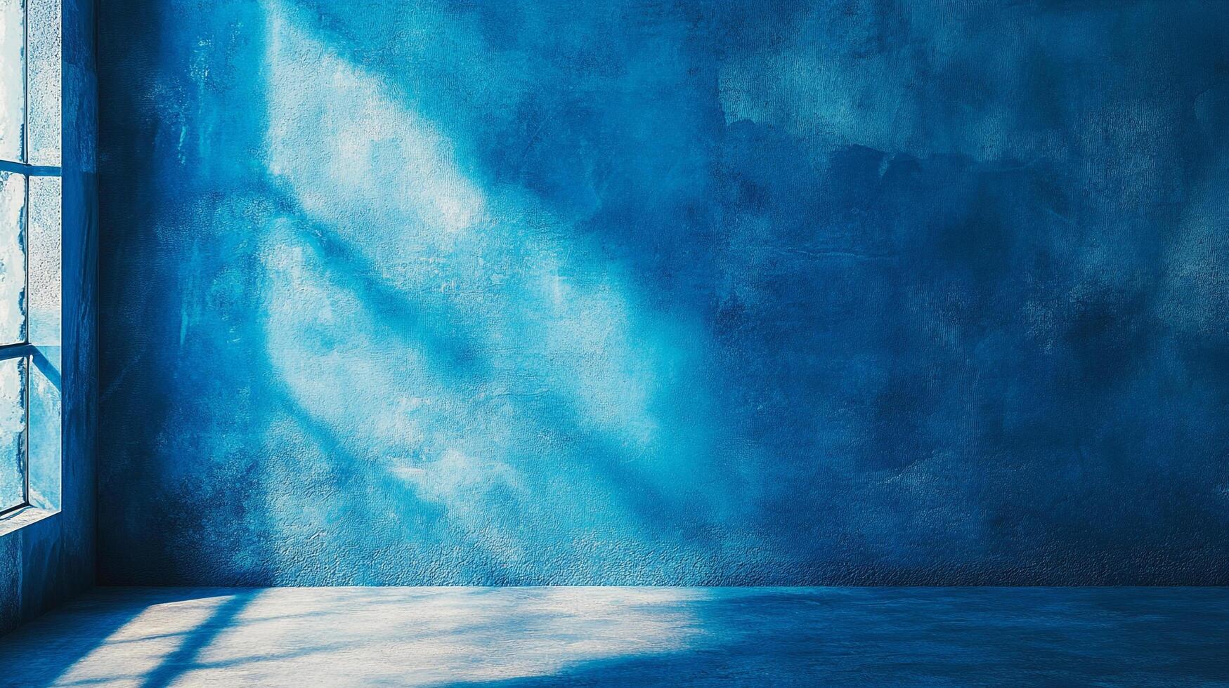 Blue wall illuminated by sunlight, abstract background with light and shadow patterns creating a serene and spacious feel. photo