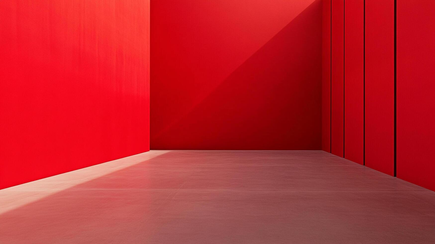 Minimalist interior with vibrant red walls meeting a neutral floor, defined by sharp angles and light play. Stark, simple and striking. photo