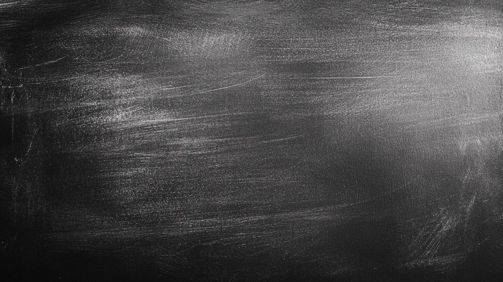 A textured black surface catches the light, creating a dynamic interplay of shadows and highlights, bringing depth to a simple background. photo