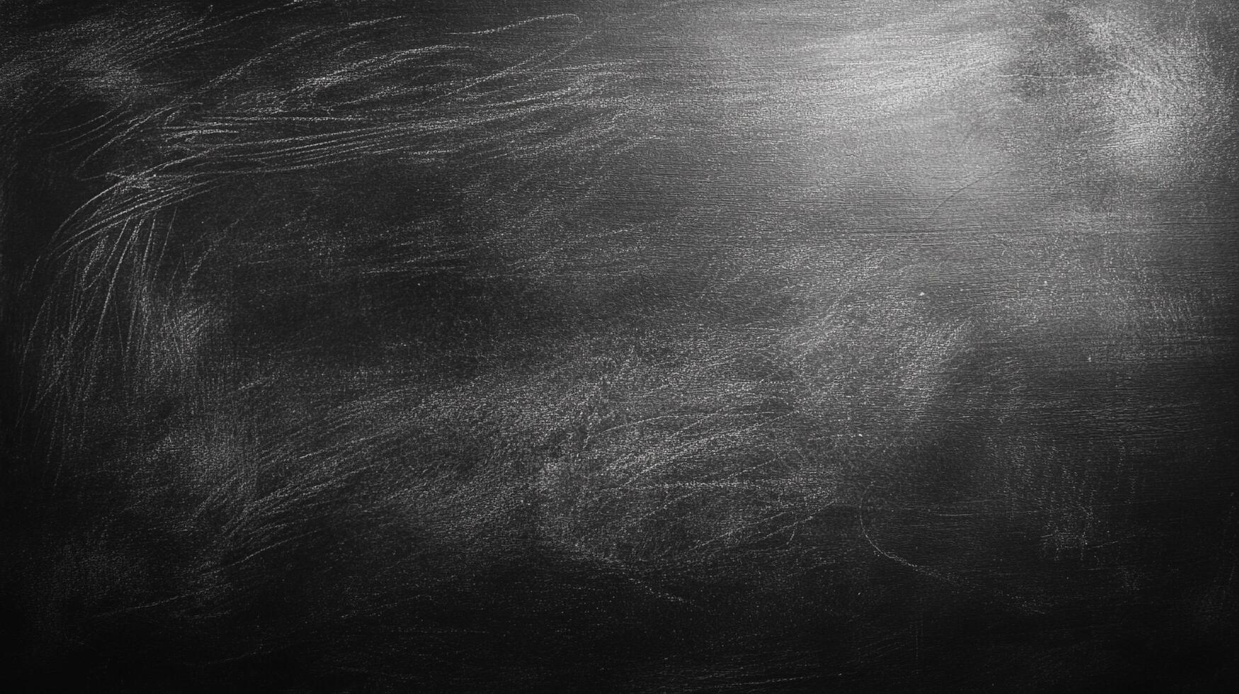 Blackboard surface with residual chalk marks. A dark and somber background with patterns. Could be used as a grungy texture. photo