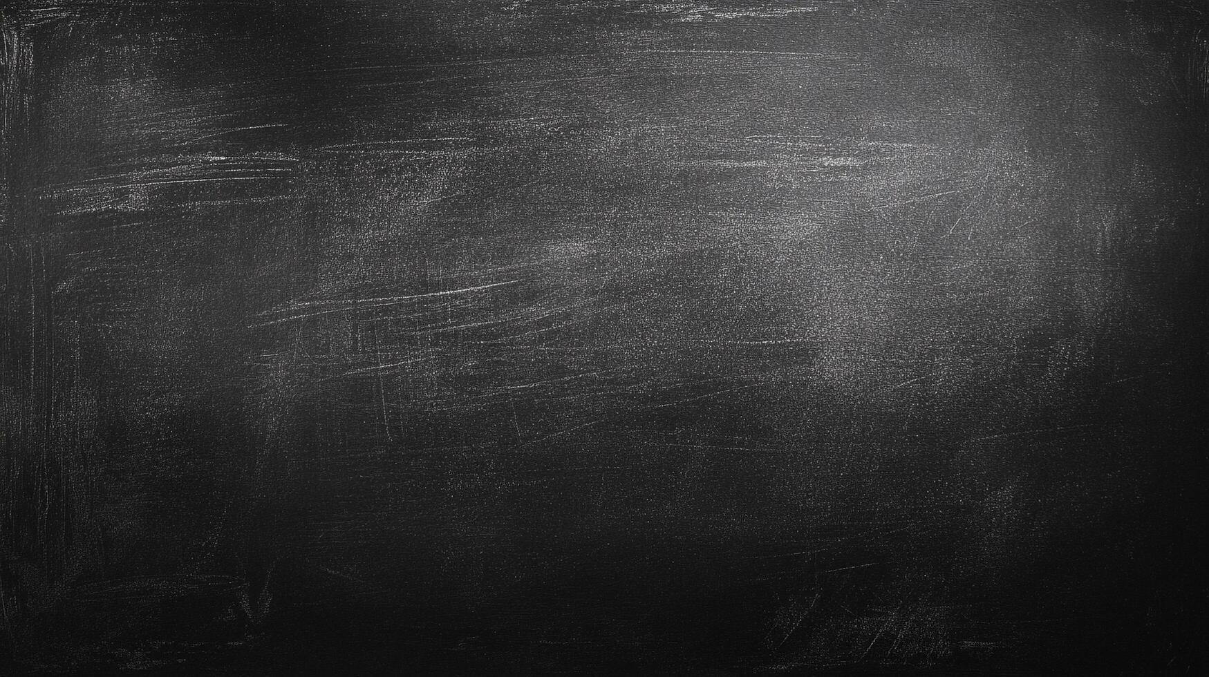 Dark chalkboard background with subtle chalk residue creates an organic, textured surface perfect for overlays and creative projects. photo